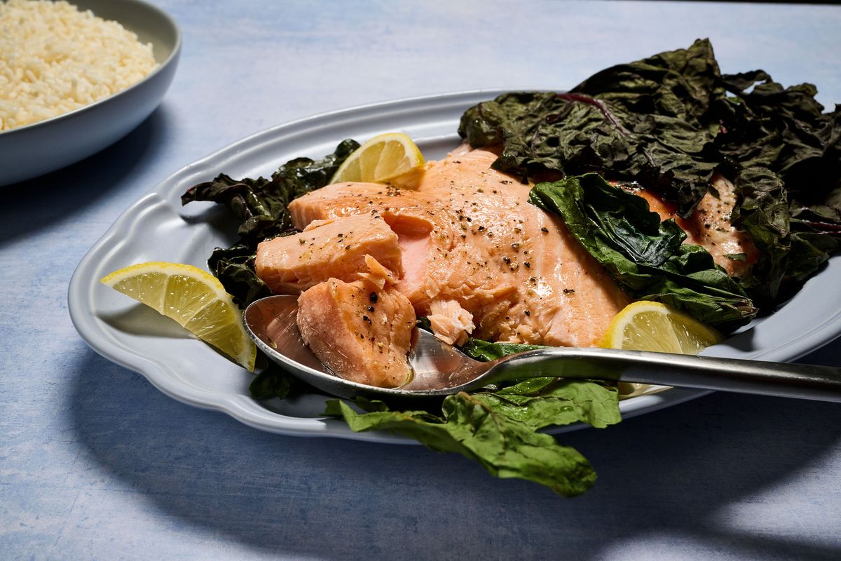 Slow-Cooked Salmon is wrapped in Swiss chard leaves and cooked in a low-heat oven. (Photos by Marvin Joseph; food styling by Lisa Cherkasky/The Washington Post)