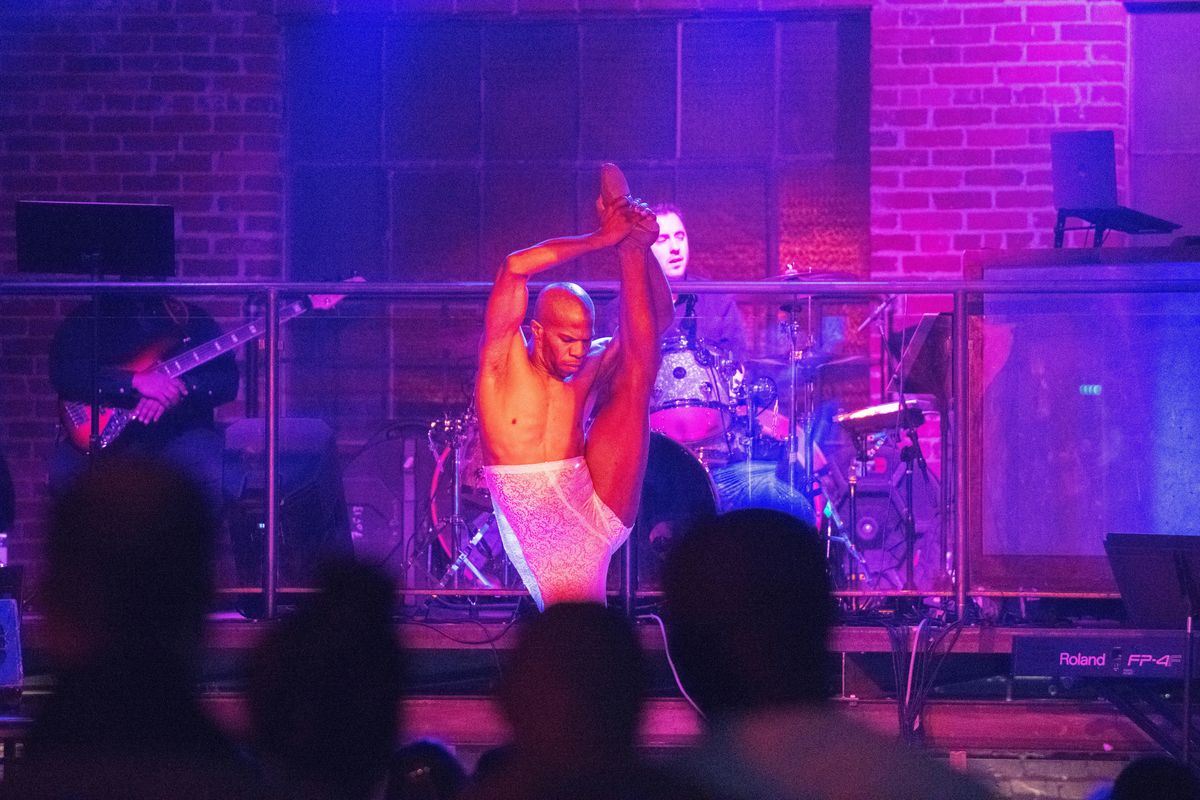 Dance captain Chris McKenzie from the touring cast of “The Lion King” demonstrates his flexibility while dancing onstage before a packed house at nYne Bar in Spokane Monday, January 28, 2019. The cast, currently in residence at the First Interstate Center for the Arts through Feb. 3, took their one night off to perform an AIDS benefit. (Jesse Tinsley / The Spokesman-Review)