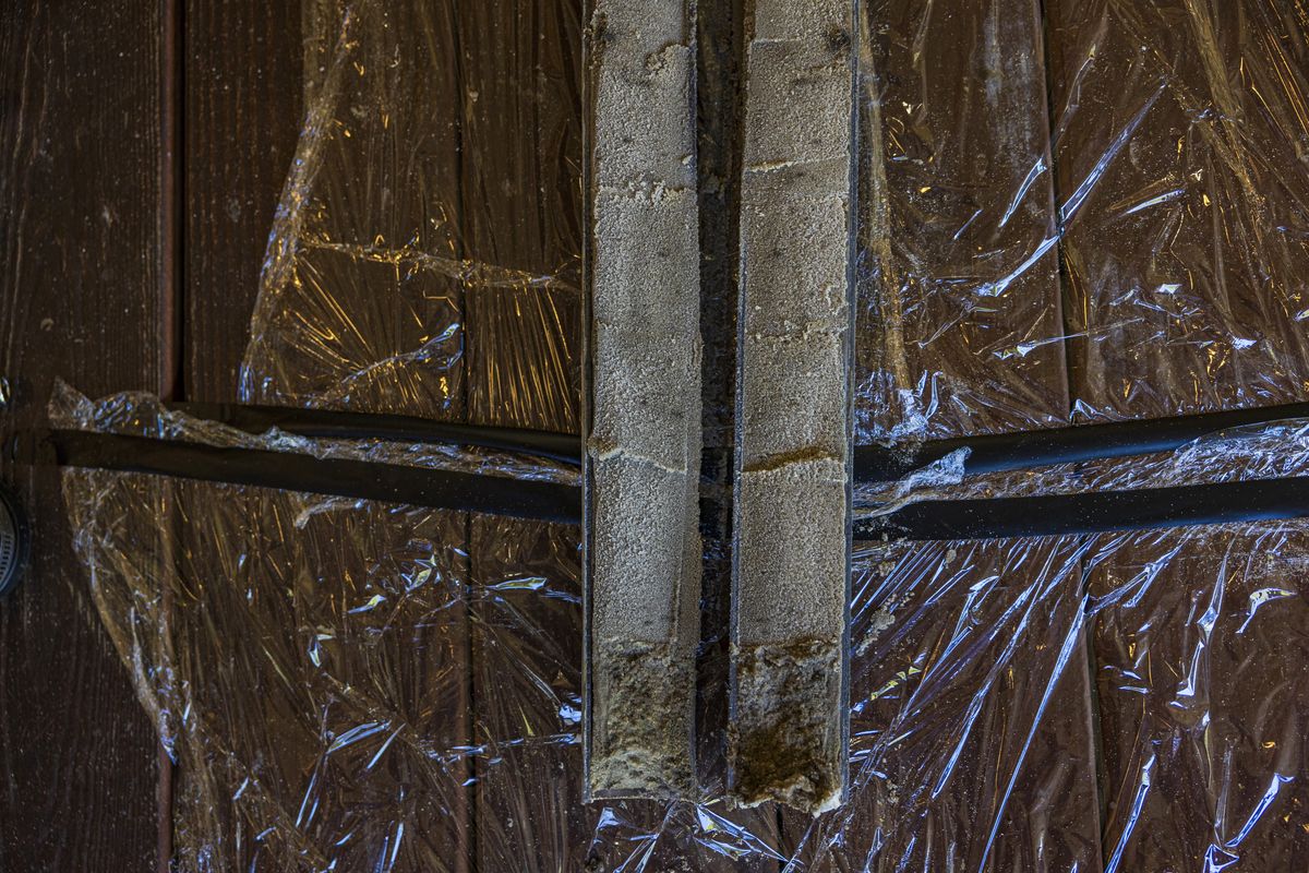 A plastic tube containing a sediment core from the bottom of Campbell Lake.   (Saul Martinez/for The Washington Post)