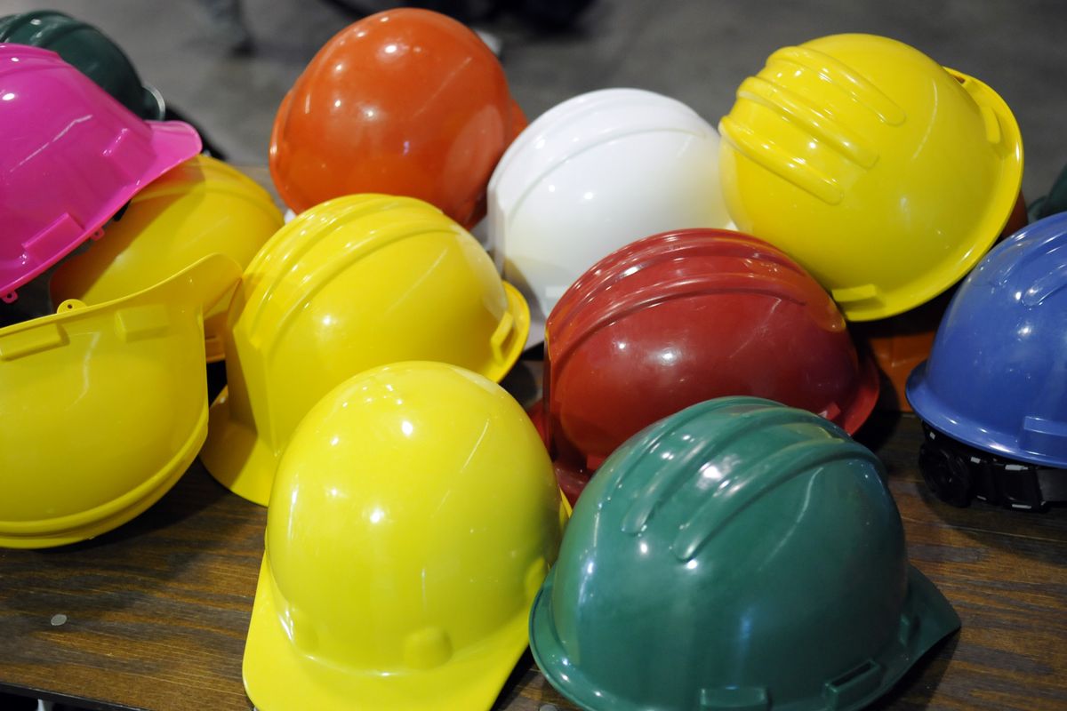 Students were given hard hats, eye and ear protection, and appropriate safety clothing for hands-on stations during Construction Career Day Wednesday. (The Spokesman-Review)