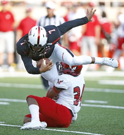 Texas Tech’s Jett Duffey  tries to break away from Eastern Washington’s Anfernee Gurley  during a game, Saturday, Sept. 2, 2017, in Lubbock, Texas. (Brad Tollefson / AP)