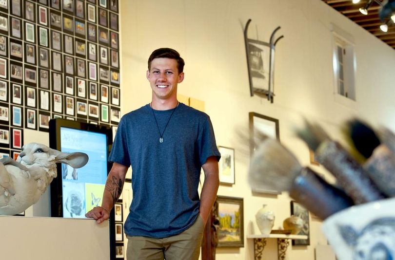 Twenty-year-old Mason Miles is the nation's youngest art curator. He talked about the 20th anniversary Art Spirit Gallery show, which he hung himself. (Kathy Plonka/SR photo)