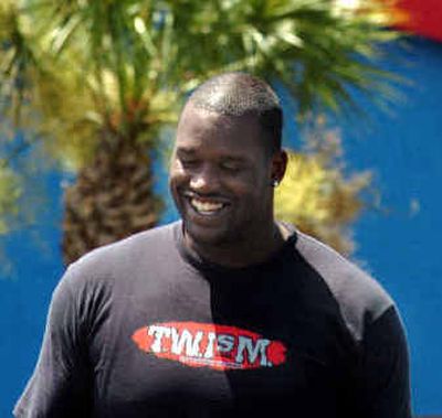 
Center Shaquille O'Neal is all smiles as his trade to the Miami Heat could be finalized as soon as today.
 (Associated Press / The Spokesman-Review)