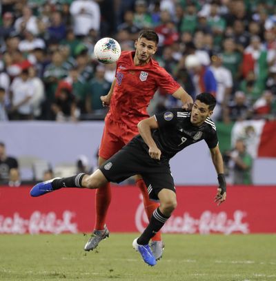 United States defender Matt Miazga, left, and Mexico defender Edson Alvarez battle for the ball during the first half of the CONCACAF Gold Cup final soccer match at Soldier Field in Chicago, Sunday, July 7, 2019. (Nam Y. Huh / Associated Press)