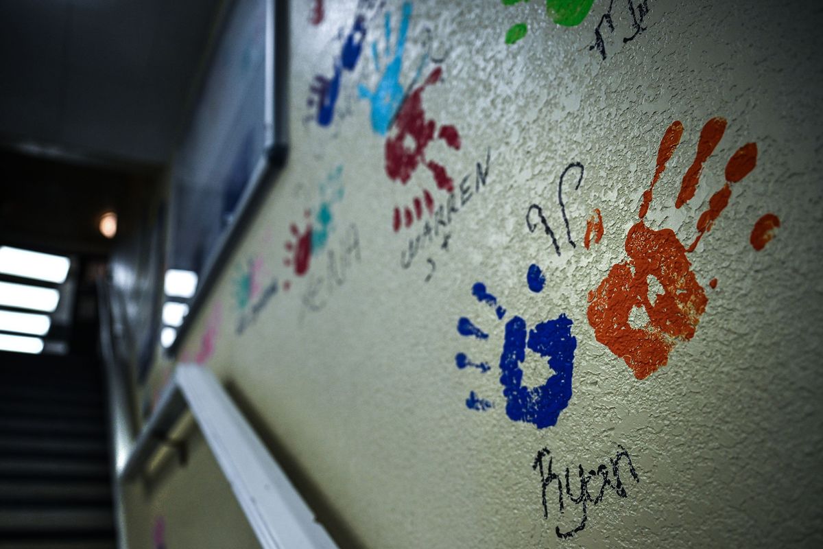 Butterfly hands of clients that have transitioned to permanent housing line the walls at Catholic Charities’ transitional housing facility, the Catalyst Project on May 17.  (Kathy Plonka/The Spokesman-Review)