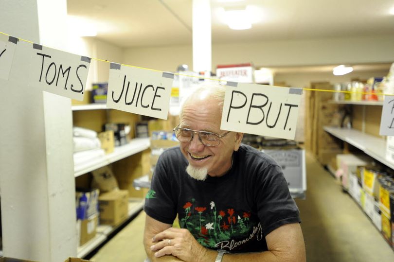 In this July 28, 2009, file photo, David Thorin  pauses while sorting food in the basement of Spokane Valley Partners, the non-profit that runs the Valley Food Bank.
  (Jesse Tinsley / The Spokesman-Review)