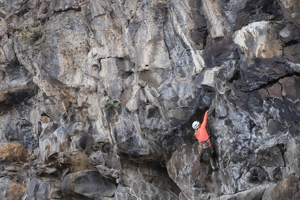 Cozeth Sykes climbs at the Crank Cave near Firth, Idaho., in late September. (John Roark / Post Register)