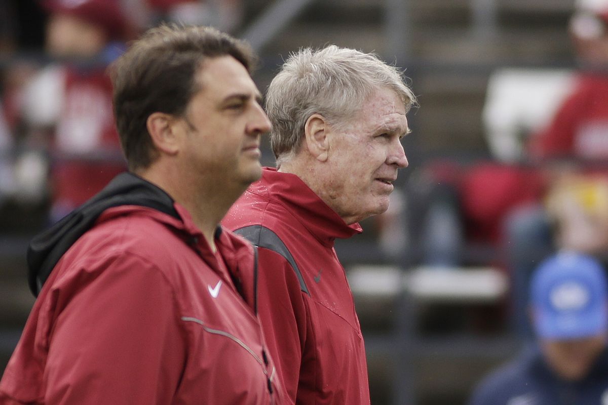WSU quarterbacks coach Dan Morrison, right, stands Saturday next to offensive coordinator Brian Smith.  (Associated Press)