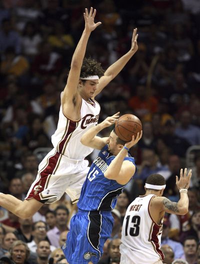 Cleveland’s  Anderson Verajao goes up to block Orlando’s Hedo Turkoglu.  (Associated Press / The Spokesman-Review)