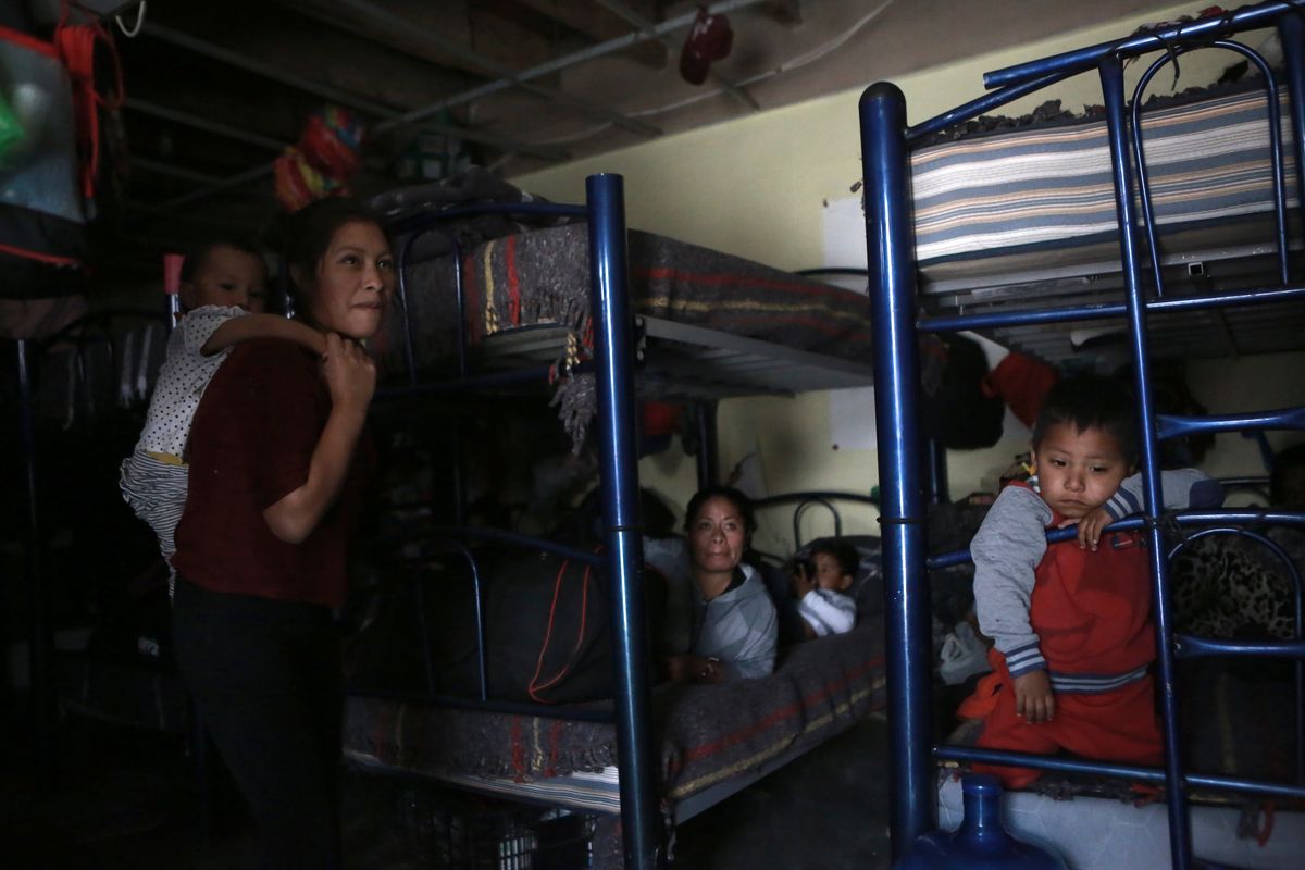 FILE - Migrants rest in a dormitory of the Good Samaritan shelter in Juarez, Mexico, March 29, 2022. The vast majority of people staying at the shelter are women and their children from Mexico and Central America who have been expelled under Title 42 authority or were still waiting to try for asylum, according to Pastor Juan Fierro, the shelter's director.  (Christian Chavez)