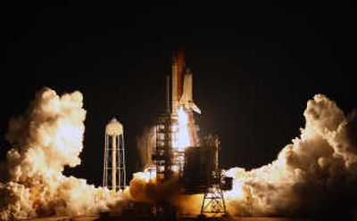 
The space shuttle Endeavour thunders off the launch pad early Tuesday at the Kennedy Space Center in Cape Canaveral, Fla. Associated Press
 (Associated Press / The Spokesman-Review)
