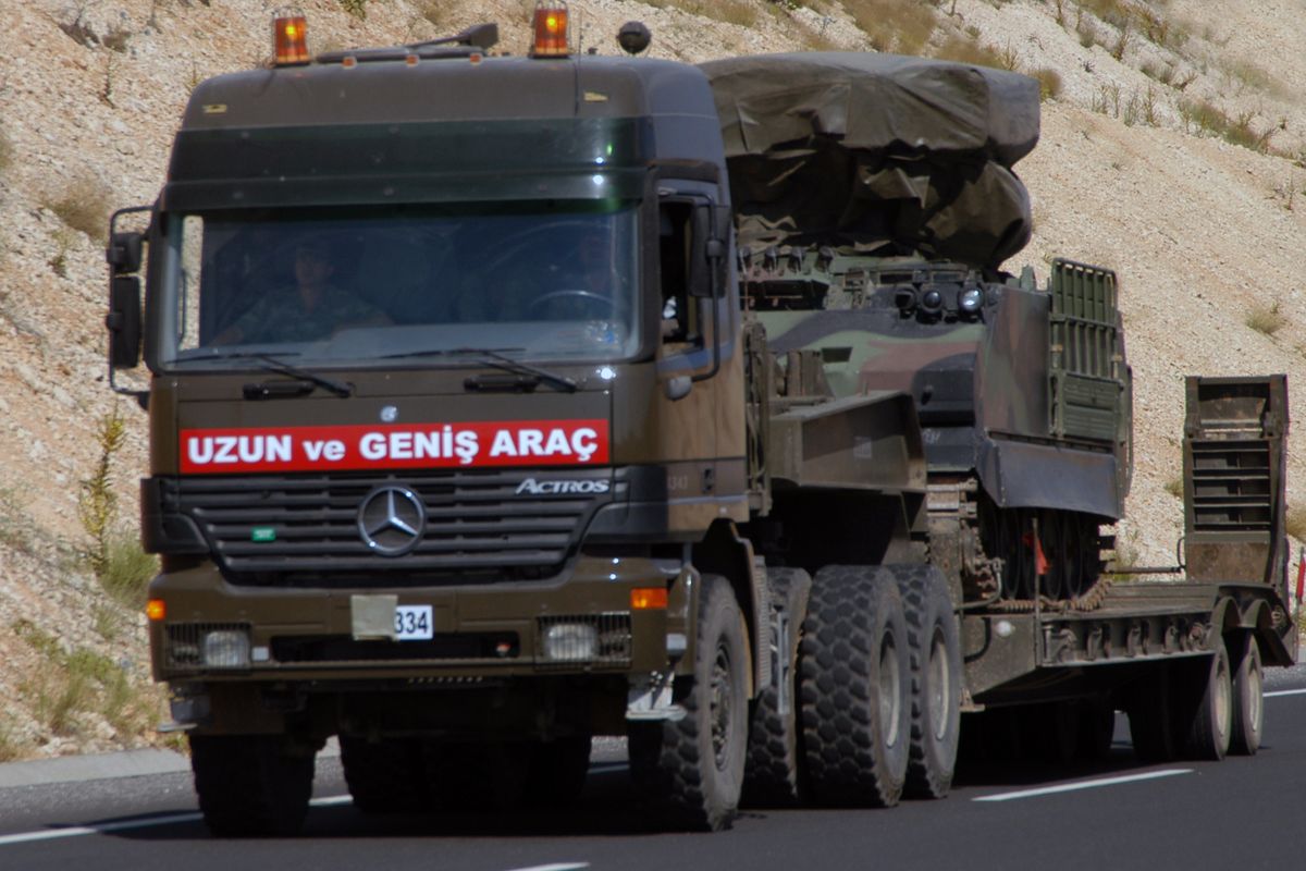 A Turkish military truck transports a mobile missile launcher to the Syrian border on Thursday, following the downing of one of its warplanes by Syrians last week. (Associated Press)