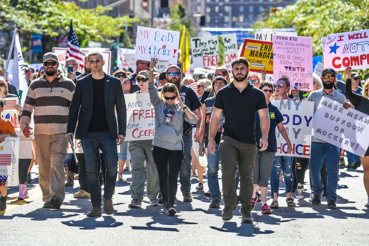 People march along Post Street on Saturday during the Rally for Medical Freedom in Spokane.  (DAN PELLE/THE SPOKESMAN-REVIEW)