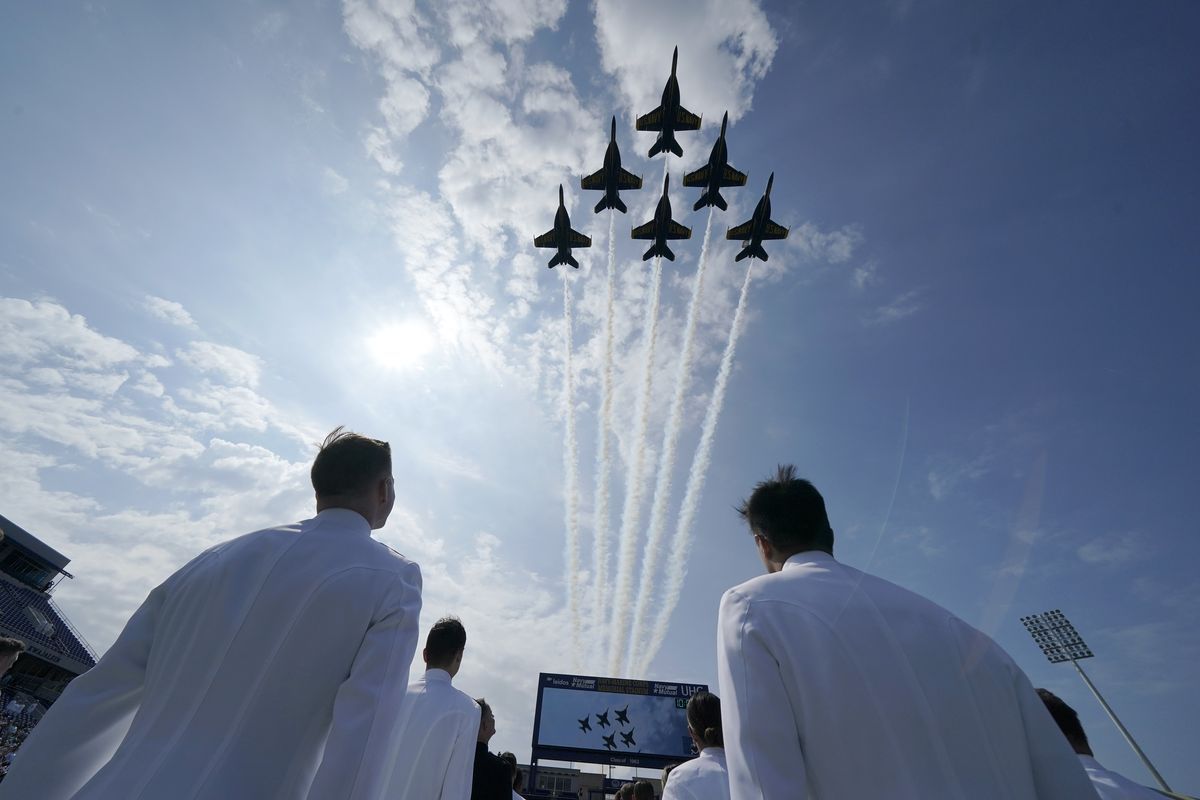The Blue Angels fly over the graduation and commissioning ceremony at the U.S. Naval Academy in Annapolis, Md., Friday, May 28, 2021.  (Julio Cortez)