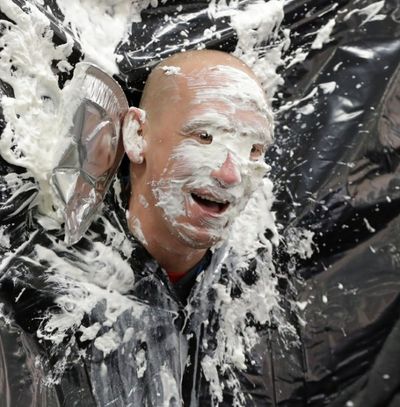 Third grade teacher Jonathan Segerstron, is seen after getting pied in front of the student body at the Hamtramck Academy Tuesday, March 14, 2017, in Hamtramck, Mich. Students at the school recited pi and celebrated pi by throwing a pie in the face of their favorite teacher. Hamtramck Academy is a free public charter school that serves students in kindergarten through eighth grade. (AP Photo/Carlos Osorio)