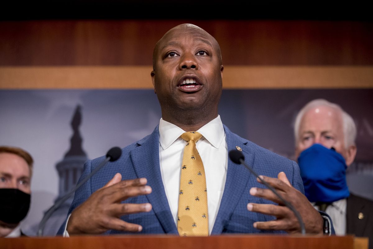 FILE - In this June 17, 2020, file photo, Sen. Tim Scott, R-S.C., accompanied by Republican senators speaks at a news conference to announce a Republican police reform bill on Capitol Hill in Washington. Initially reluctant to speak on race, Scott is now among the Republican Party’s most prominent voices teaching his colleagues what it’s like to be a Black man in America.  (Andrew Harnik)