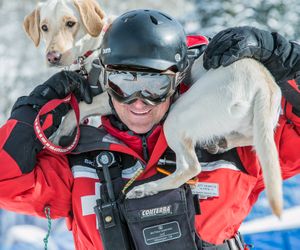 Jeff Thompson, executive director of the Idaho Panhandle Avalanche Center, with his avalanche rescue dog, Annie. (U.S. Forest Service)