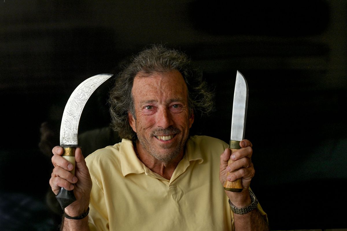 Joe Pallaria displays two knives from his collection at his home in Spokane Valley on Friday. The one on the left is from Turkey and the on the right is from Norway.  (Kathy Plonka/The Spokesman-Revie)