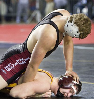 North Central’s Bryson Pierce holds O’Dea’s Logan Flones in 170-pound, opening-round match. (Patrick Hagerty)