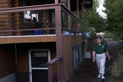 
SCOPE East volunteers Marilyn Greer, front, and Lavonne Hellman walk the perimeter of a home. SCOPE volunteers will check the homes of people on vacation for burglary prevention. Hellman said, 