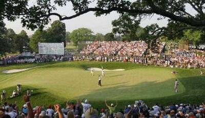 
U.S Open champ Geoff Ogilvy tips his cap to the crowd after finishing his final round on the 18th green at Winged Foot.
 (Associated Press / The Spokesman-Review)