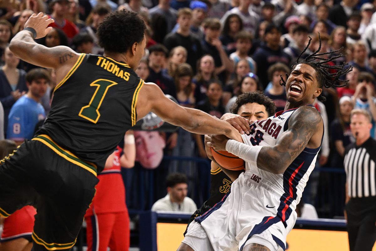 Gonzaga Bulldogs guard Khalif Battle (99) battles against San Francisco Dons guard Malik Thomas (1) while driving the ball during the first half of a college basketball game on Thursday, Feb. 13, 2025, at McCarthey Athletic Center in Spokane, Wash. (Tyler Tjomsland/The Spokesman-Review)