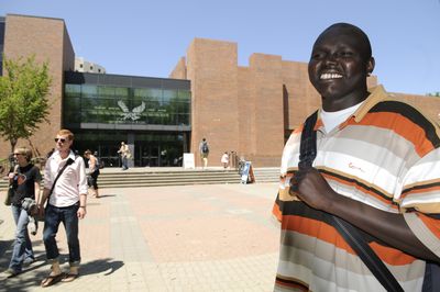 David Atem, shown  Wednesday outside the student union building at Eastern Washington University in Cheney, fled Sudan in the care of an aunt when he was 3 years old. He graduates from EWU on Saturday with a degree in economics.jesset@spokesman.com (Jesse Tinsley / The Spokesman-Review)