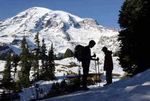 
 Hikers pause at the base of Mount Rainier during a day hike Nov. 27, 2002, inside Mount Rainier National Park. On Sunday, Mount Rainier shook with a 3.2-magnitude earthquake, but scientists said the quake does not signal an eruption soon. 
 (File/Associated Press / The Spokesman-Review)