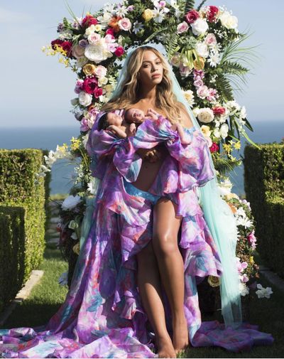 In this undated image released by Parkwood Entertainment on Friday, July 14, 2017, Beyonce posed with her newborn twins Sir Carter and Rumi. The singer posted the picture on Instagram late Thursday night and wrote in the caption, “Sir Carter and Rumi 1 month today.” She didn’t mention the babies’ genders, but Beyonce’s mother wrote on Instagram that the pop star had given birth to a boy and a girl. (Mason Poole / Parkwood Entertainment)