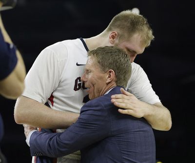 Gonzaga head coach Mark Few hugs Przemek Karnowski after a college basketball regional semifinal game against UCLA in the NCAA Tournament Friday, March 27, 2015, in Houston. Gonzaga won 74-62. (David Phillip / Associated Press)