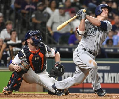 Kyle Seager watches his home run that gave the Mariners the lead in the 10th inning of a baseball game, Monday, July 17, 2017, in Houston. (Eric Christian Smith / Associated Press)