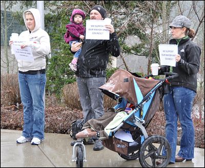 Jennifer Drake (left), with husband, Ben, and Sara Meyer are shown protesting the launch of the unsuccesful 2012 recall effort against then mayor Sandi Bloem and three council members. The two women later would be instrumental in stopping the effort that divided the city of Coeur d'Alene.