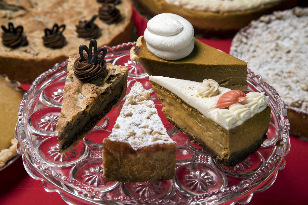 It could be very difficult to choose. Clockwise from top are slices of pumpkin pie, pumpkin cheesecake, apple tart and Kentucky Bourbon Chocolate Chip tart from Just American Desserts. (Colin Mulvany / The Spokesman-Review)