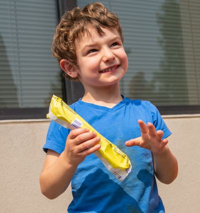 Avery Sohn, 4, shows his excitement after obtaining a multiflavored Rainbow Popsicle from an ice cream truck on July 31, 2018. The truck was owned and serviced by Patrick Gleesing, who owns CC Delivery in Spokane.  (Libby Kamrowski/The Spokesman-Review)
