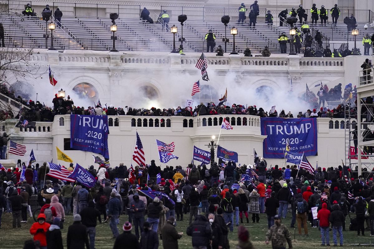 FILE - In this Wednesday, Jan. 6, 2021, file photo, rioters storm the Capitol, in Washington. Capitol Police say they have intelligence showing a “possible plot” by a militia group to breach the U.S. Capitol on Thursday, nearly two months after a mob of supporters of then-President Donald Trump stormed the iconic building to try to stop Congress from certifying now-President Joe Biden