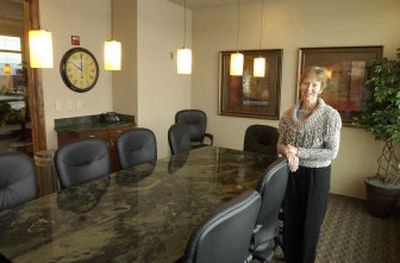 
Century 21 Beutler and Associates branch manager/broker Debbie Dyche shows off the new conference room at the Liberty Lake office. 
 (J. BART RAYNIAK / The Spokesman-Review)