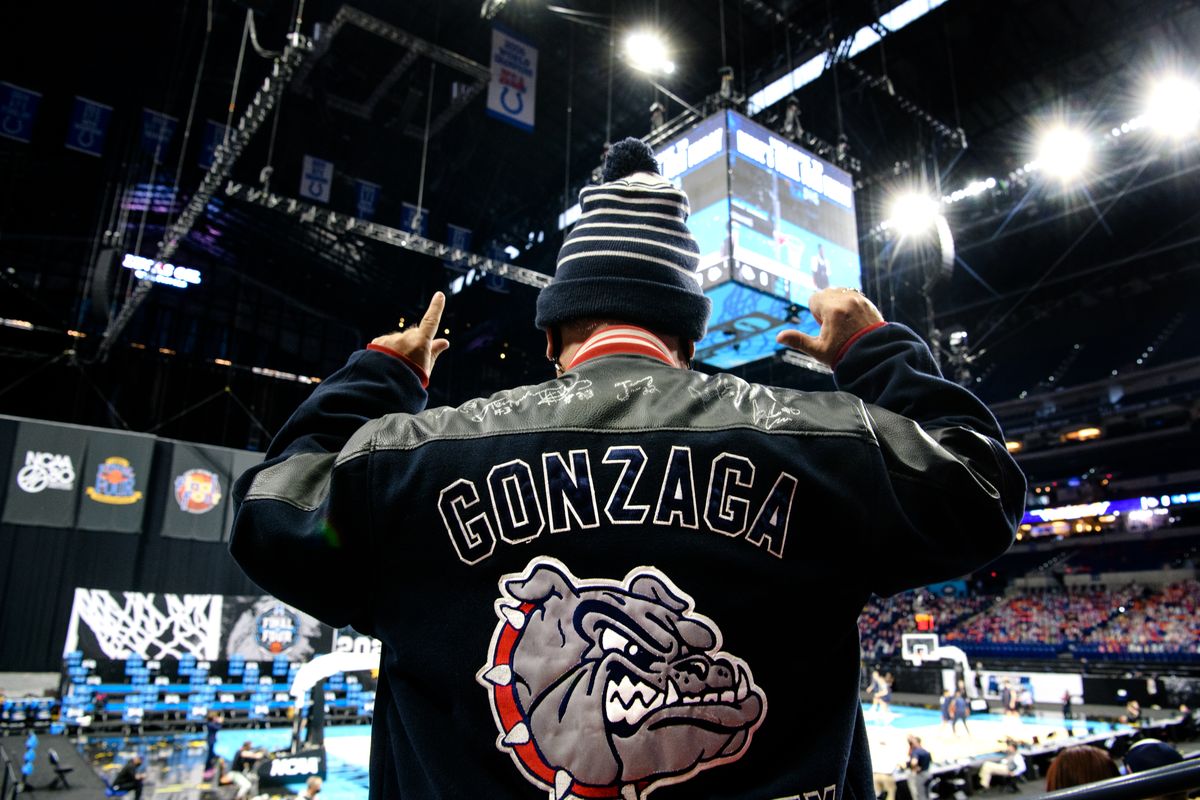 Rory Rankin, a former Gonzaga University track and cross country runner and 1988 GU graduate, wears a custom GU letterman’s jacket signed by the 2018 team as Gonzaga warms up during a practice session on Friday in Indianapolis.  (TYLER TJOMSLAND/THE SPOKESMAN-REVIEW)