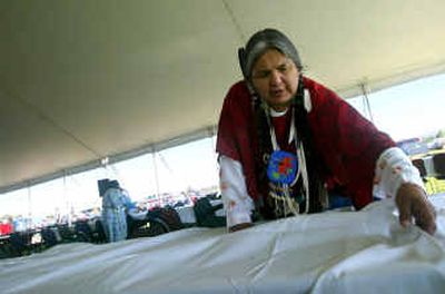 
Angela Buck, an enrolled Yakama tribal member, helps set up Thursday for the annual elders dinner, part of Treaty Days celebrations at Yakama Nation Legends Casino in Toppenish, Wash. 
 (Associated Press / The Spokesman-Review)