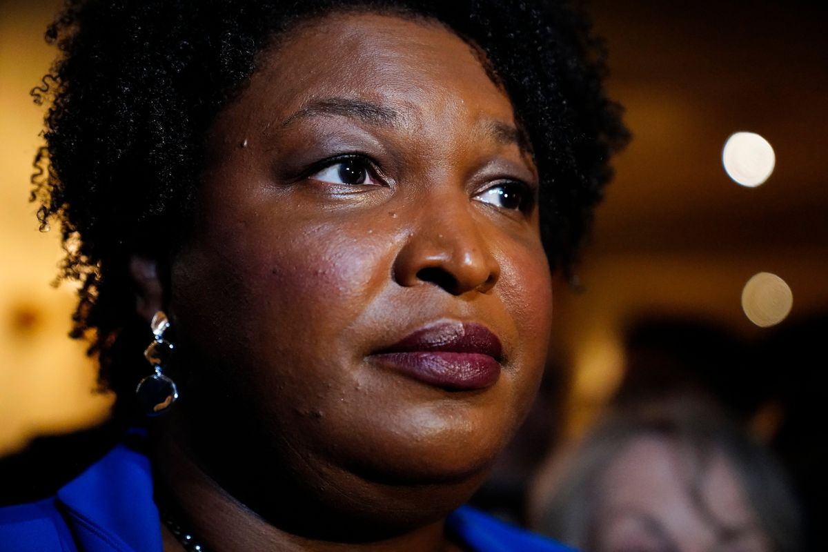 FILE - Georgia gubernatorial Democratic candidate Stacey Abrams talks to the media after qualifying for the 2022 election on Tuesday, March 8, 2022, in Atlanta. When she ended her first bid to become Georgia governor in 2018, Abrams announced plans to sue over the way the state’s elections were managed. More than three years later, as she makes another run at the governor’s mansion, the lawsuit filed in Nov. 2018 by Abrams