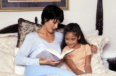 Show interest in your child's book choices, and she may be more likely to choose reading over watching television or playing video games.
(File Photo / The Spokesman-Review)