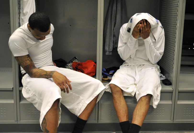 ORG XMIT: PNU161 Memphis' Chance McGrady, left, and Roburt Sallie sit dejectedly in the locker room after their team's loss to Missouri in a men's NCAA college basketball tournament regional semifinal in Glendale, Ariz., Thursday, March 26, 2009. Missouri won 102-91. (AP Photo/Chris Carlson) (Chris Carlson / The Spokesman-Review)