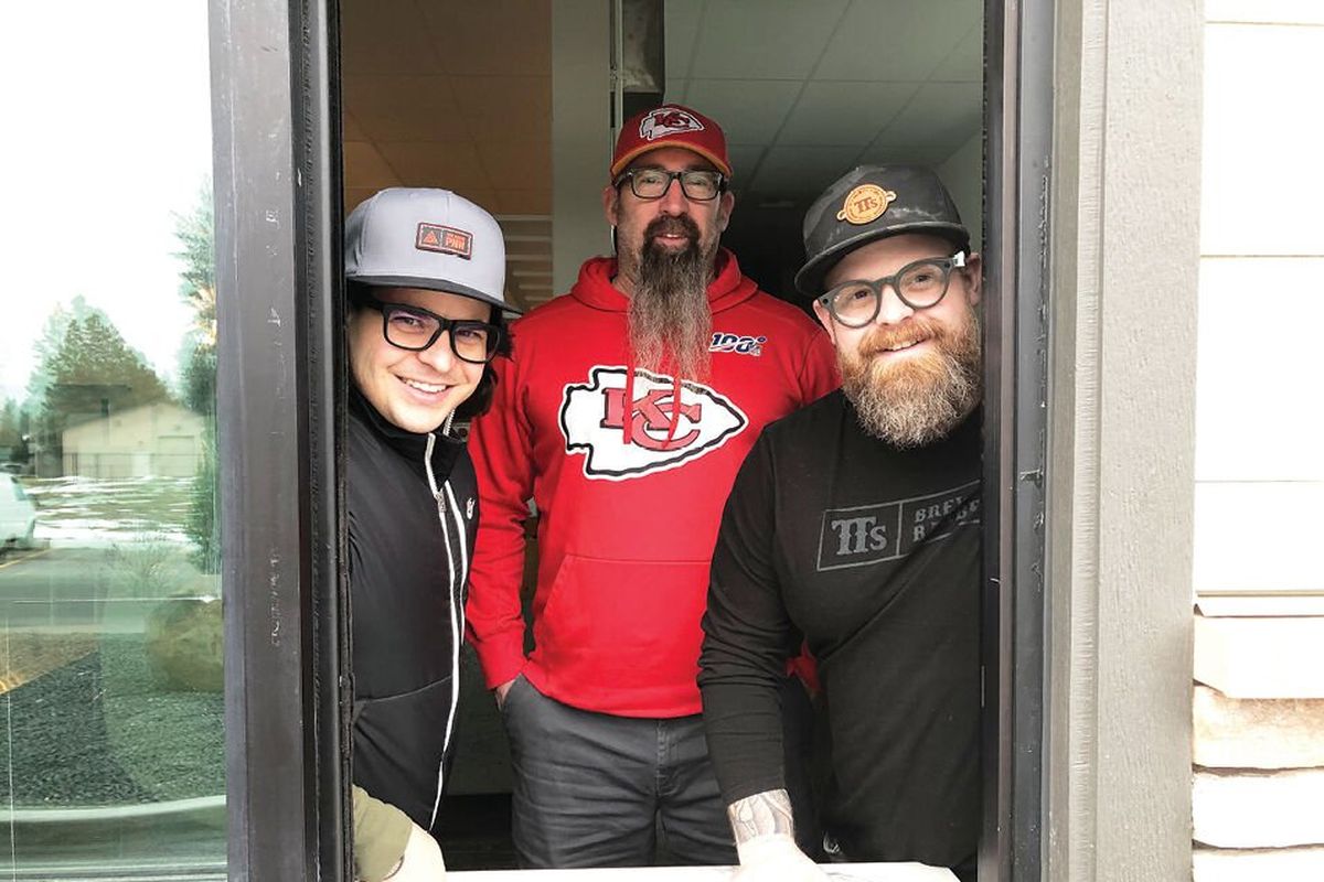 Ramsey Pruchnic, Travis Thosath and Chad White stand in the drive-thru window of the former Hello Sugar in Spokane Valley on Monday, Jan. 24. The location is the future site of taco shop Uno Mas, set to open in mid-March.  (Don Chareunsy/The Spokesman-Review)