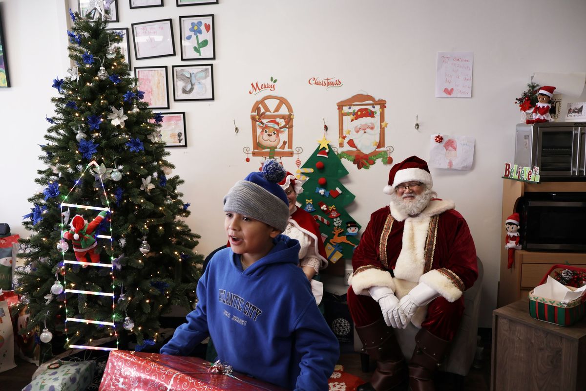 Alan Lara, 9, receives a gift from Santa at a Christmas giveaway event Dec. 21 that was sponsored by a nonprofit called BetterALife. (MUST CREDIT: BetterALife) 