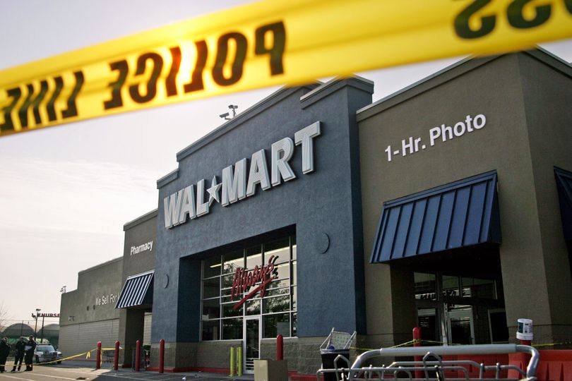 In this Nov. 28, 2008, file photo, Nassau County Police examine the front of the Wal-Mart in Valley Stream, N.Y., where a temporary Wal-Mart worker died after  shoppers broke down the doors and trampled him.   (File Associated Press)