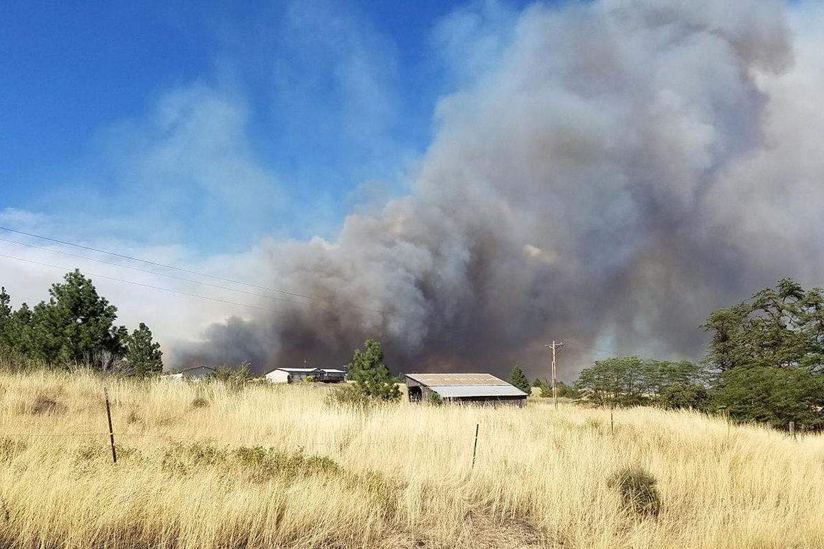 Smoke can be seen from Hart Road about a mile east of Highway 25. (Daniel Moldrem)