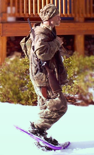 A man authorities identify as Troy James Knapp walks past a cabin in Utah. (Associated Press)