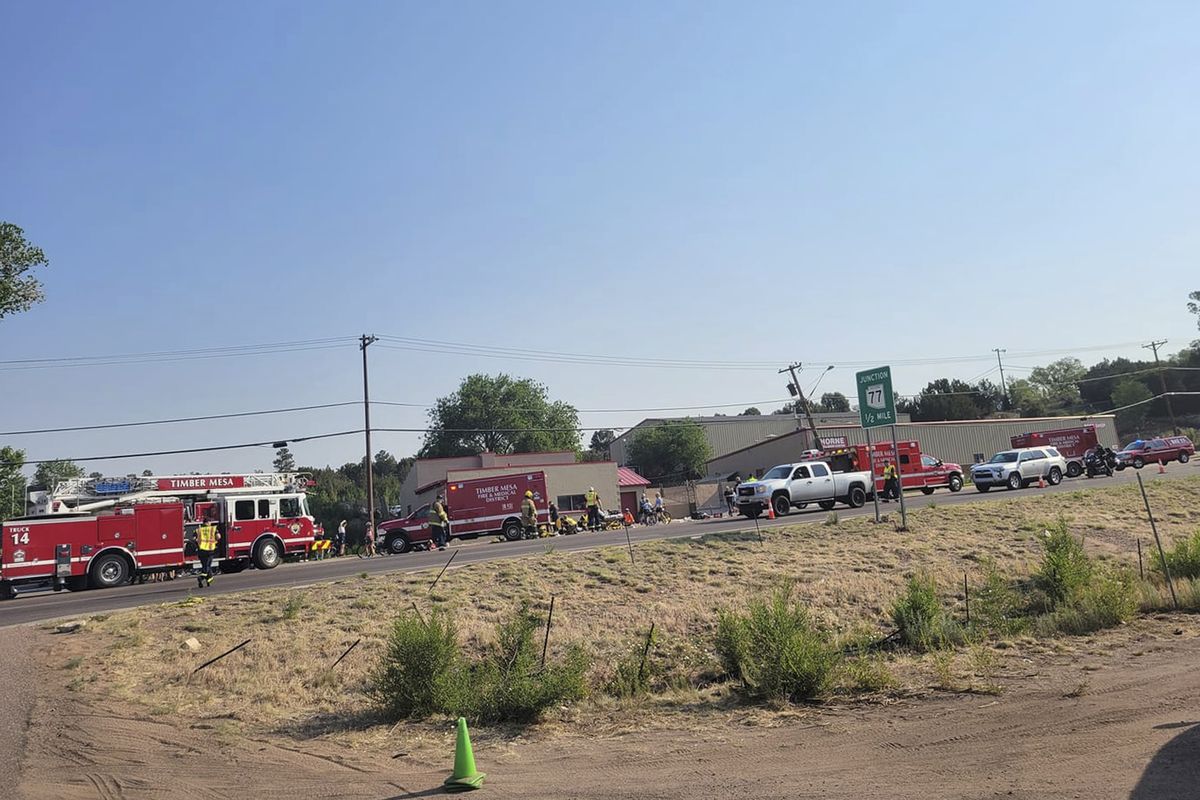 This Saturday, June 19, 2021 photo released by the Timber Mesa Fire and Medical District shows emergency personnel at the scene of a mass casualty incident near Downtown 9 in Show Low, Ariz.. Several bicyclists were injured on June 19 when Shawn Michael Chock driving a pickup truck sped into a crowd gathered for the annual 58-mile Bike the Buff race in Show Low, a mountain city about three hours northeast of Phoenix, authorities said. Witnesses described seeing the bodies of cyclists flying left and right.  (HOGP)