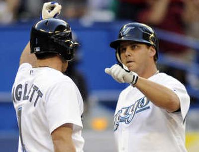 
Toronto's Joe Inglett, left, congratulates former Seattle Mariner Brad Wilkerson after his fifth-inning solo homer. Associated Press
 (Associated Press / The Spokesman-Review)