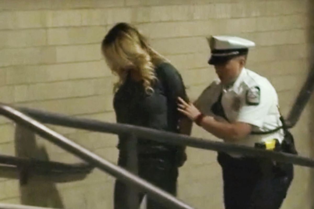 In this frame from video, porn actress Stormy Daniels is led into jail in Columbus, Ohio., after being taken into custody during a Wednesday evening, July 11, 2018, show. (Associated Press)