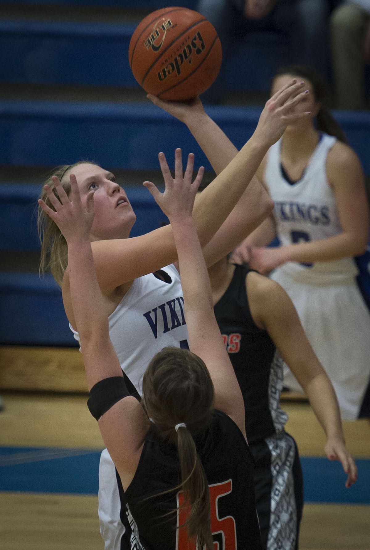 Coeur d’Alene’s Sydney Williams takes a shot as Post Falls’ Madison King defends. (Colin Mulvany)